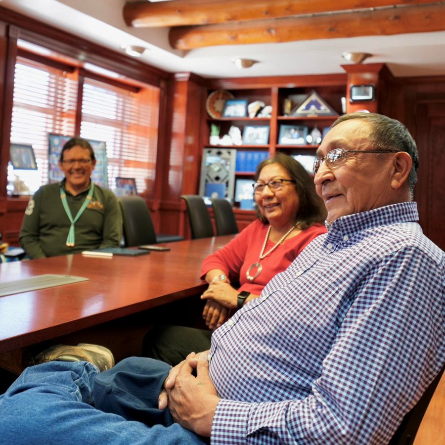 Dr. SueAnn and Arthur Manuelito seated at the conference table in the Office of the President